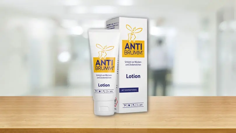 Anti Brumm Lotion Tube und Verpackung auf einem Tisch